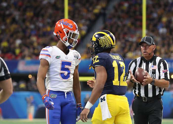 Dec 29, 2018; Atlanta, GA, USA; Florida Gators defensive back CJ Henderson (5) reacts after tackling Michigan Wolverines running back Chris Evans (12) in the first quarter of the 2018 Peach Bowl at Mercedes-Benz Stadium.